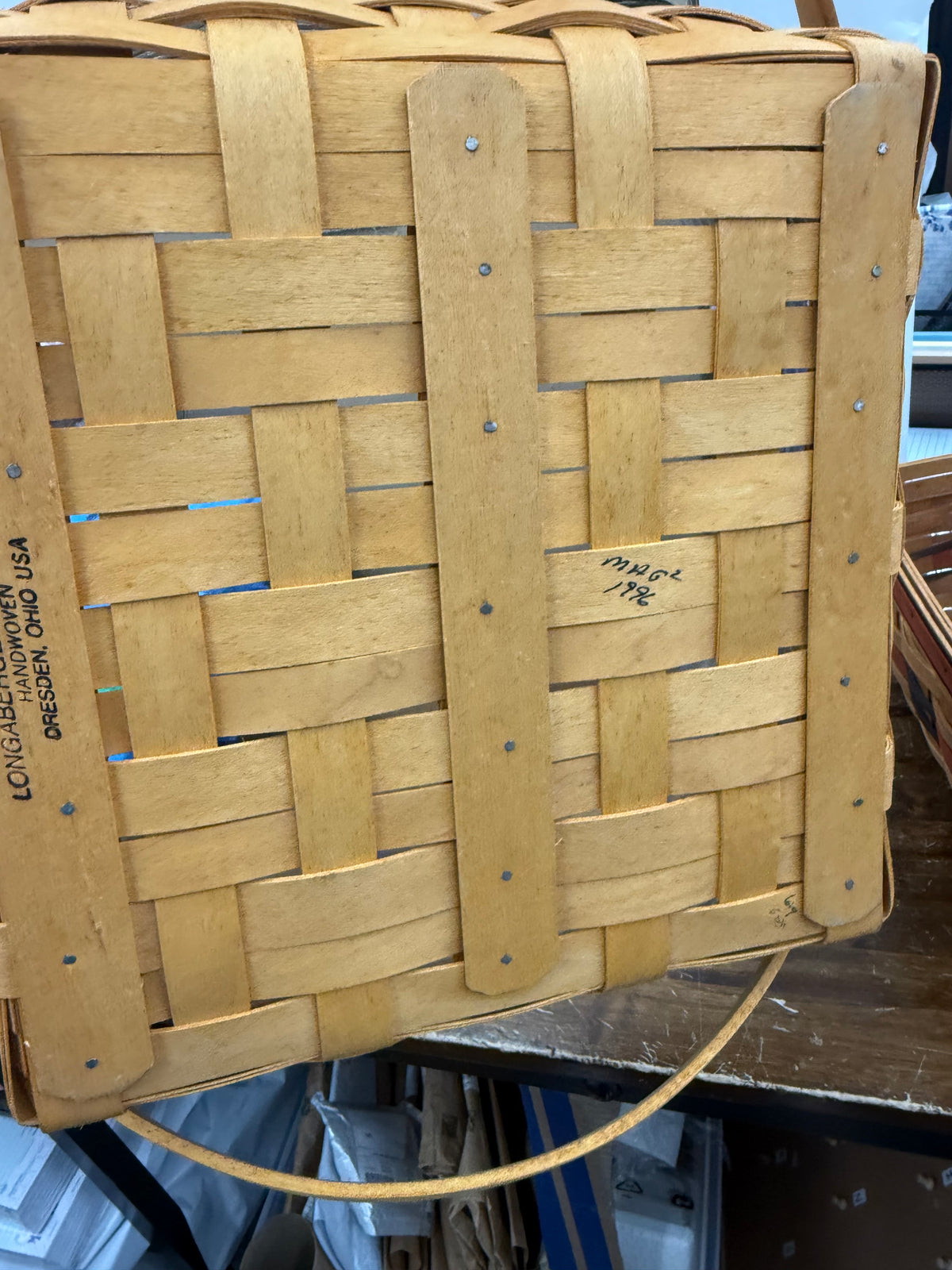 Longaberger community basket with protector and a Carol Berry tie on