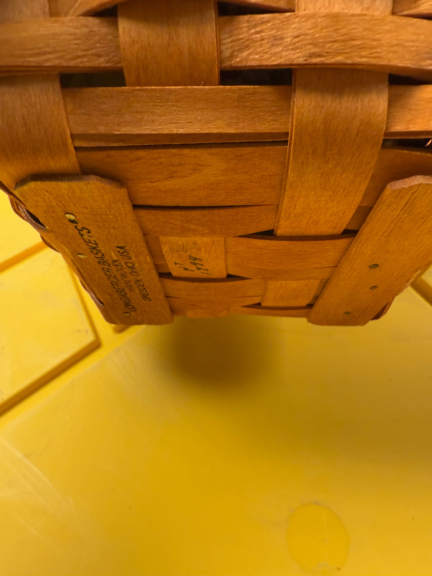 Longaberger jingle bell with lid,liner, and tie on