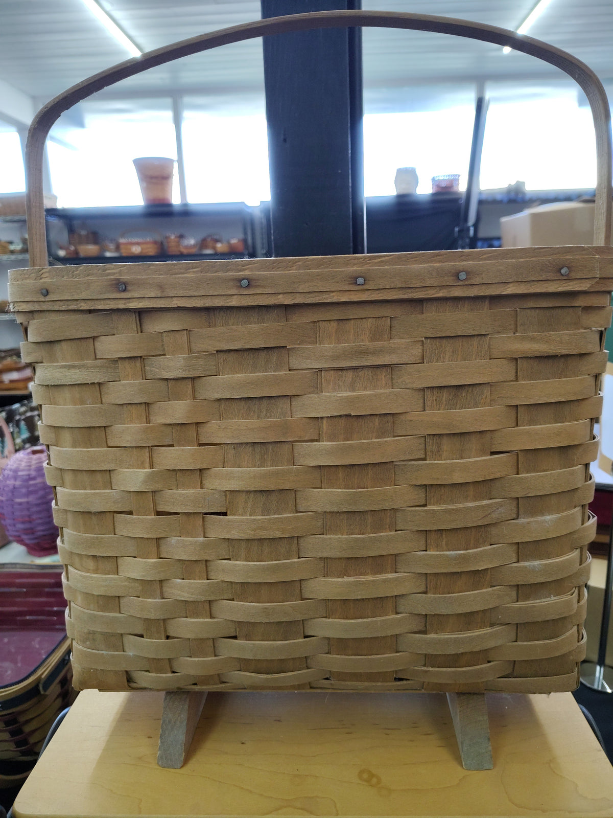 Longaberger footed magazine basket Leans forward and dusty