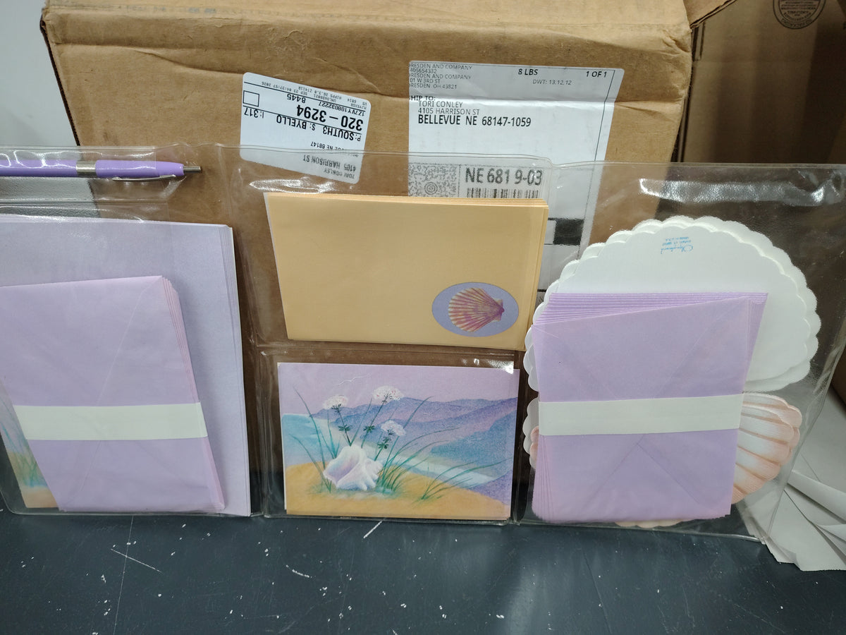 Purple seashell notes and envelopes