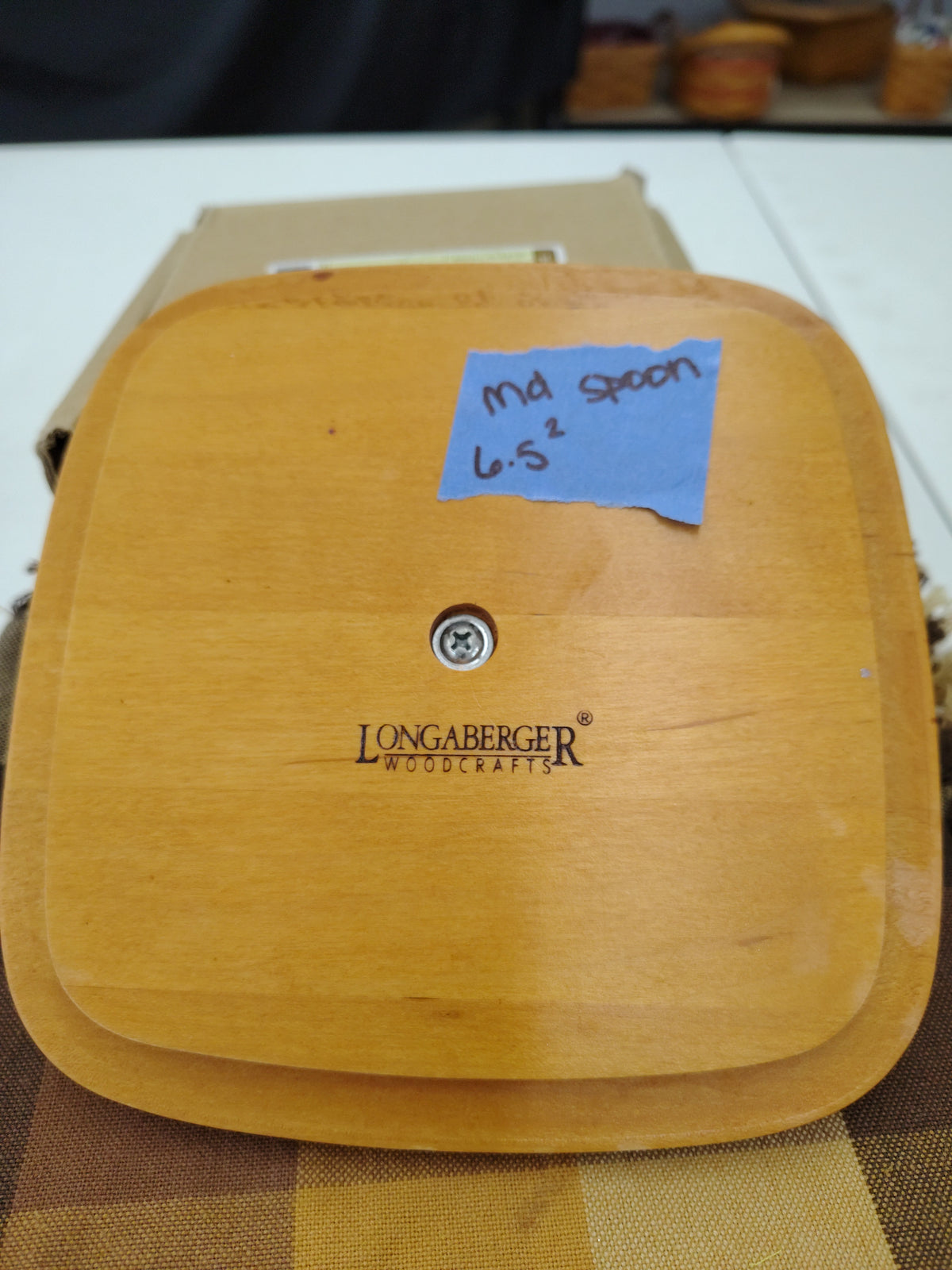 Longaberger medium spoon 6.5x6.5 lid. Has discoloration and scratches on knob