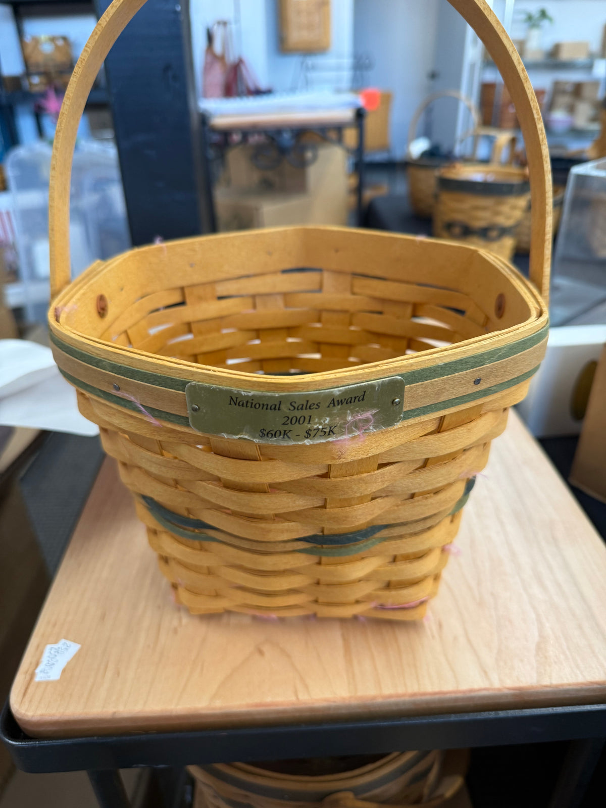 Longaberger award basket ( has pink feathers attached to it so will need cleaned up)