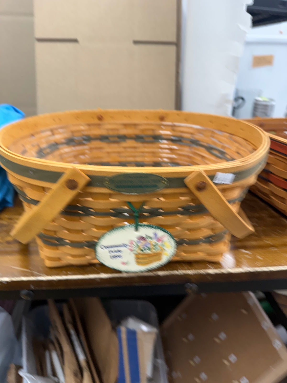 Longaberger community basket with protector and a Carol Berry tie on