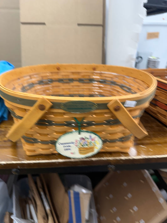 Longaberger community basket with protector and a Carol Berry tie on