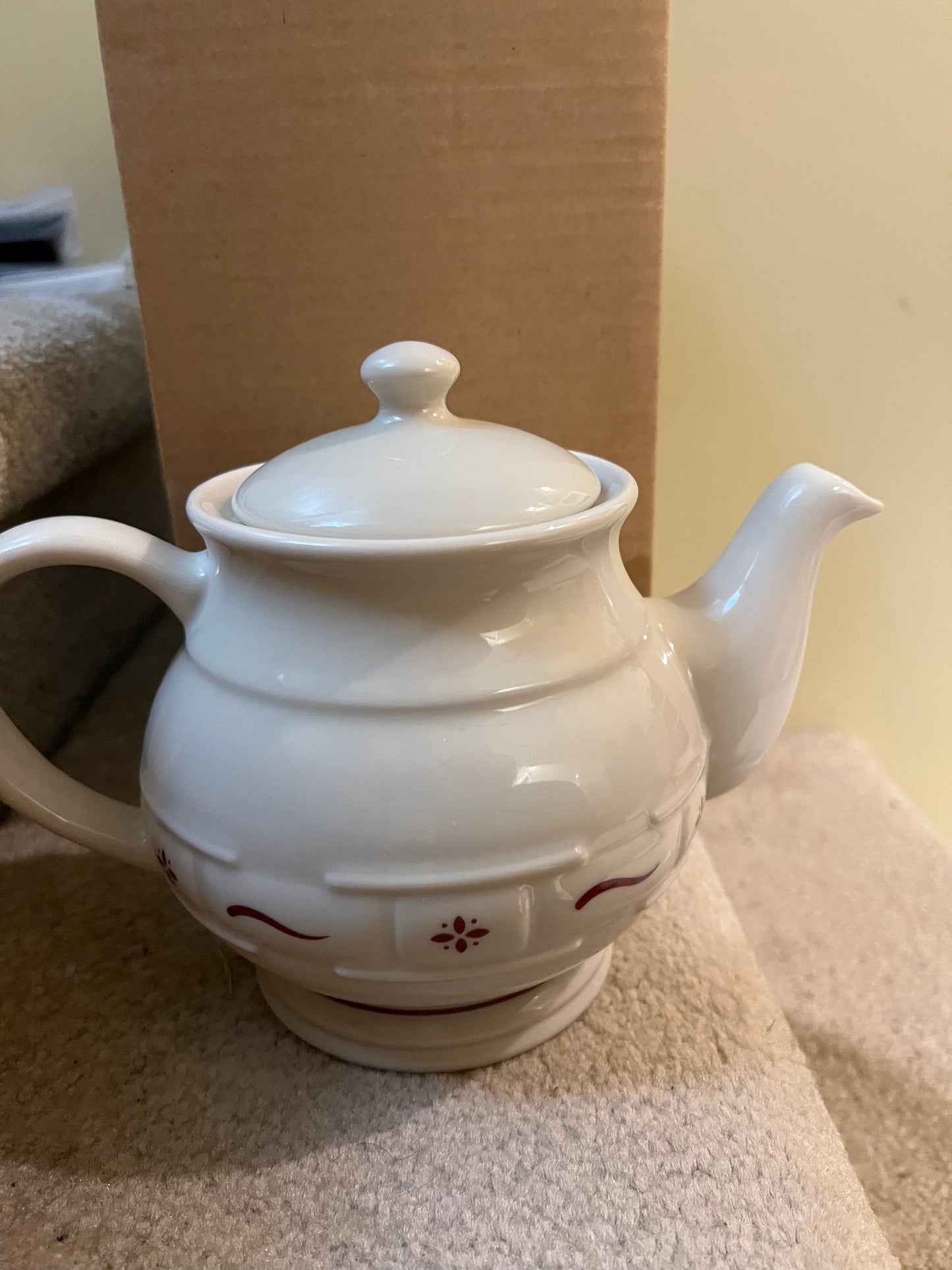 Longaberger teapot in traditional red