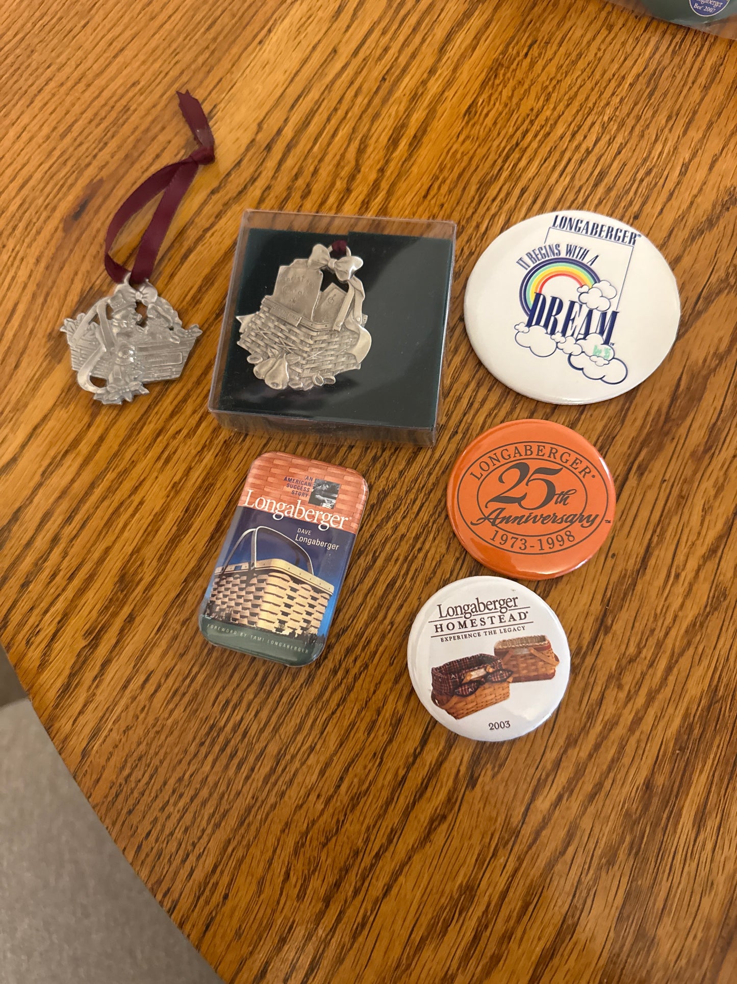 Longaberger pewter ornaments and various pins sold as a lot