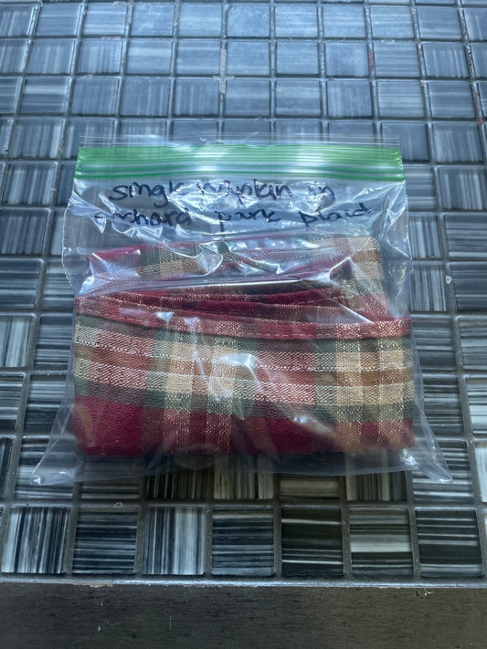 Single napkin in orchad park plaid