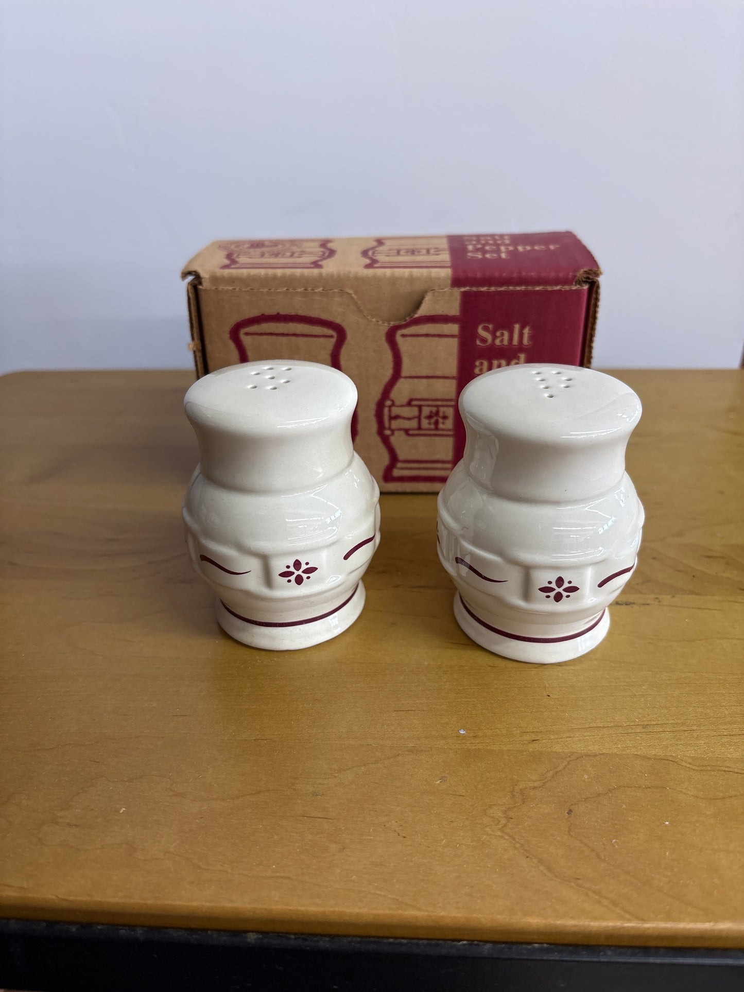 Longaberger salt and pepper shakers in traditional red