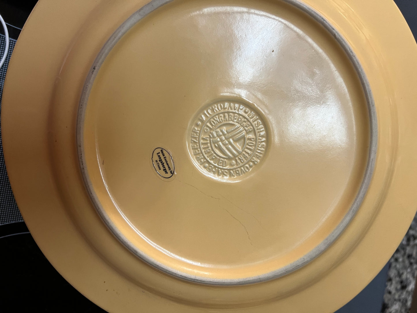 Longaberger dinner plate with marks In butternut