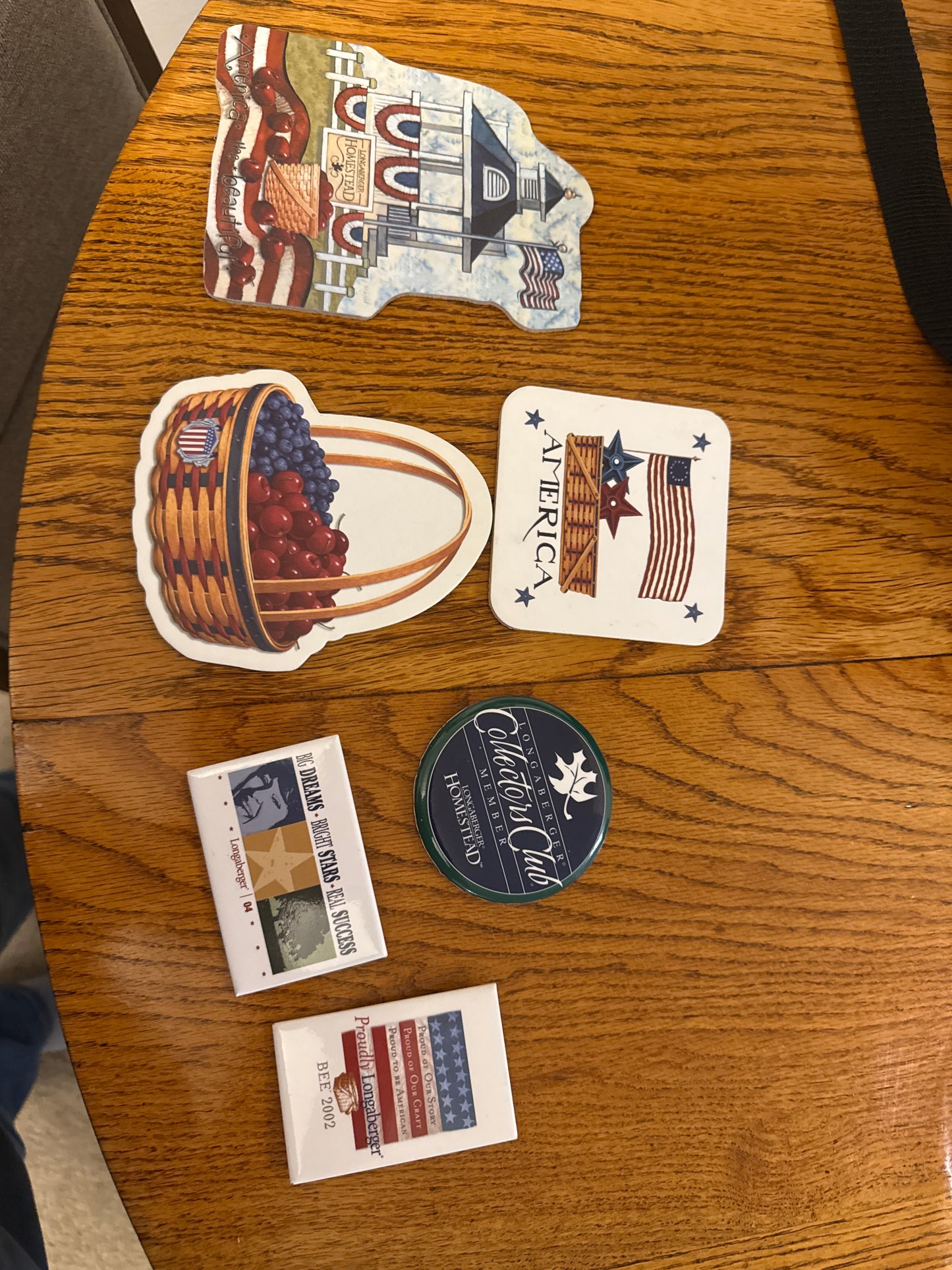 Longaberger and homestead coaster and various pins sold as a lot