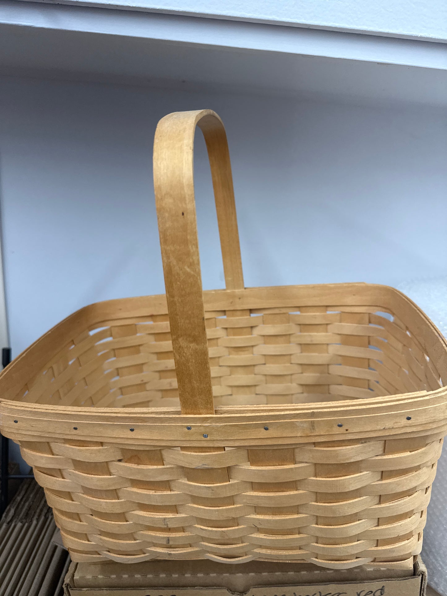 Longaberger medium market basket -has some rubbing in the front as shown and chip in corner splint