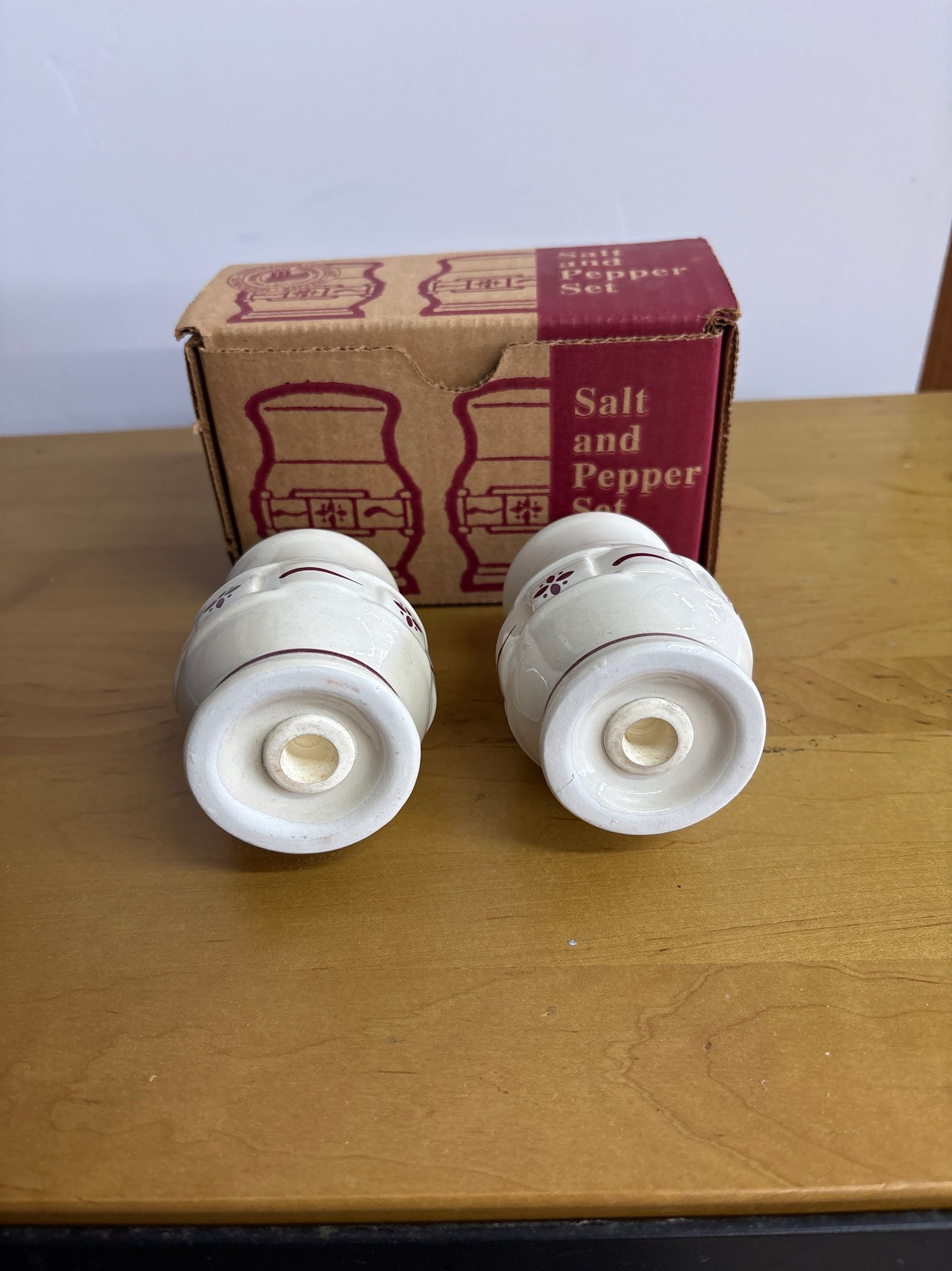 Longaberger salt and pepper shakers in traditional red