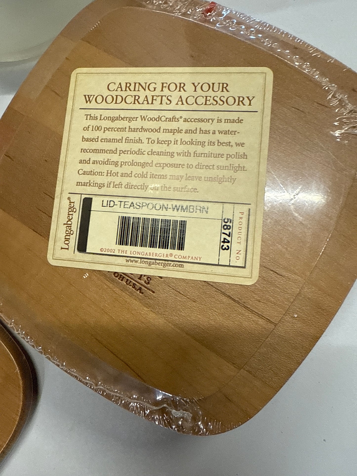Teaspoon lid in warm brown