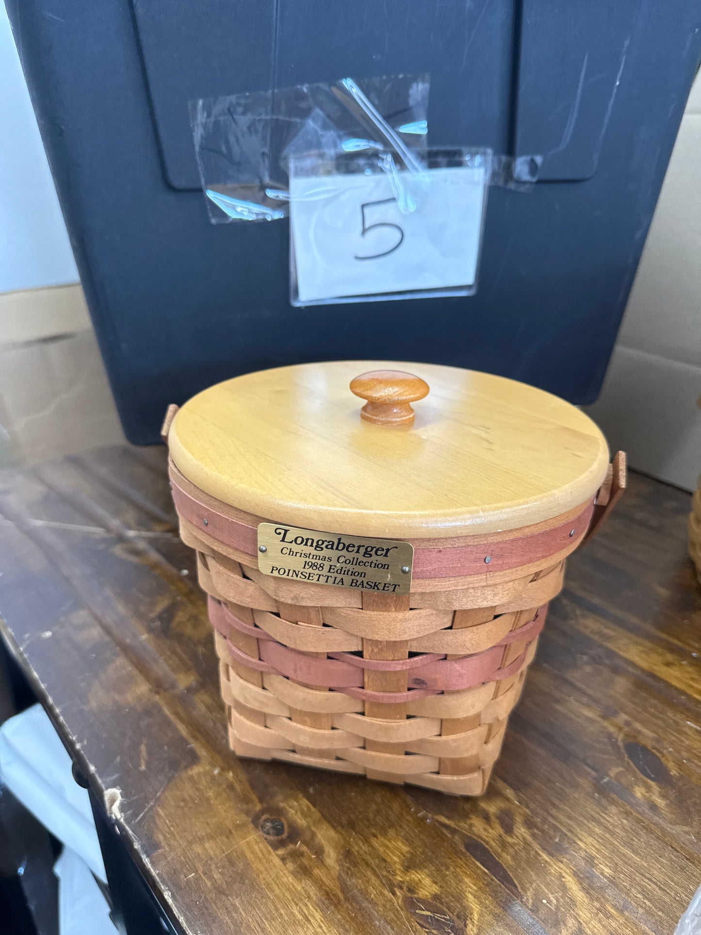 Longaberger poinsettia basket with lid and protector (has small blemish -pictured)
