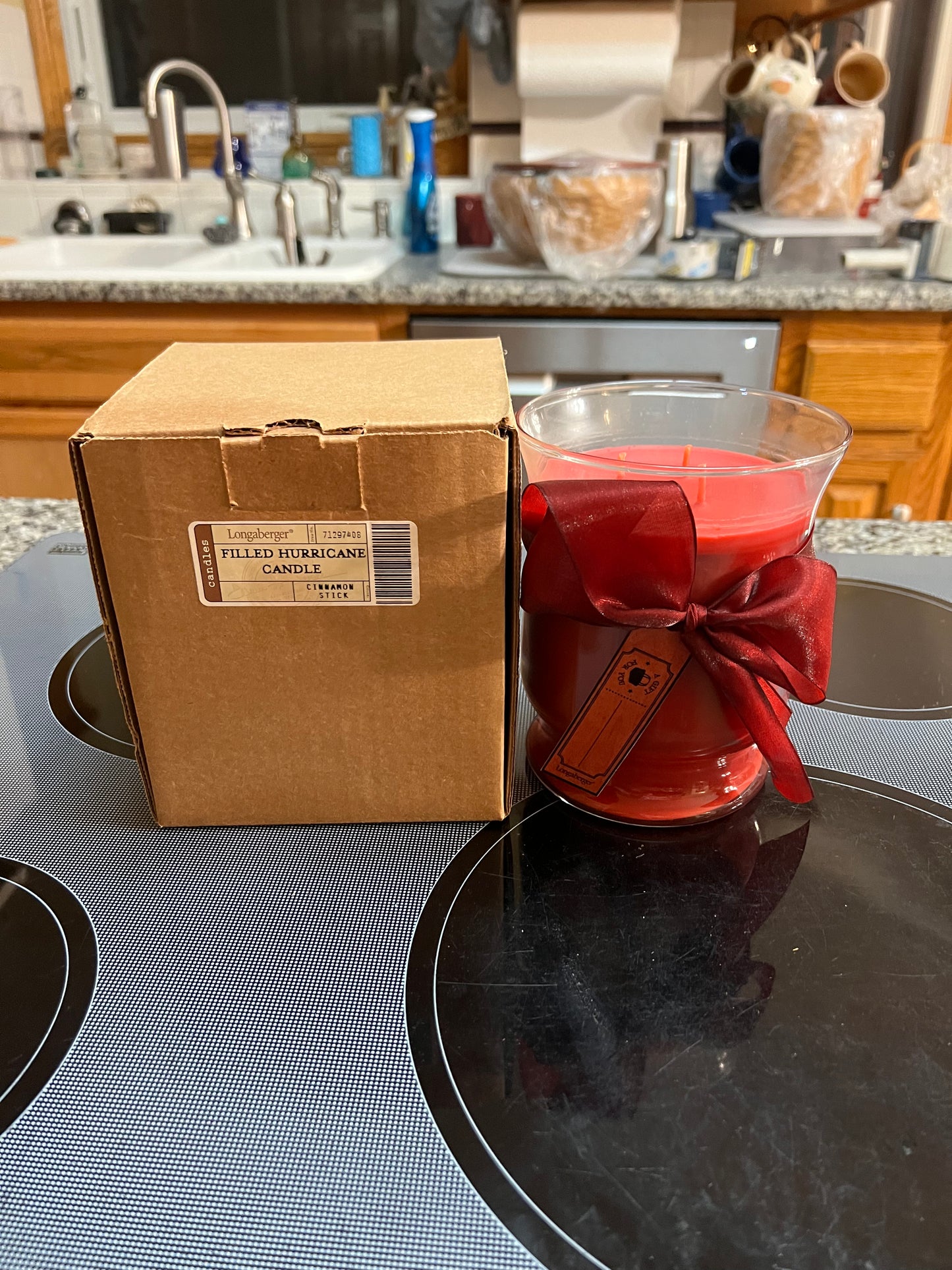 Longaberger filled hurricane candle jar in cinnamon stick