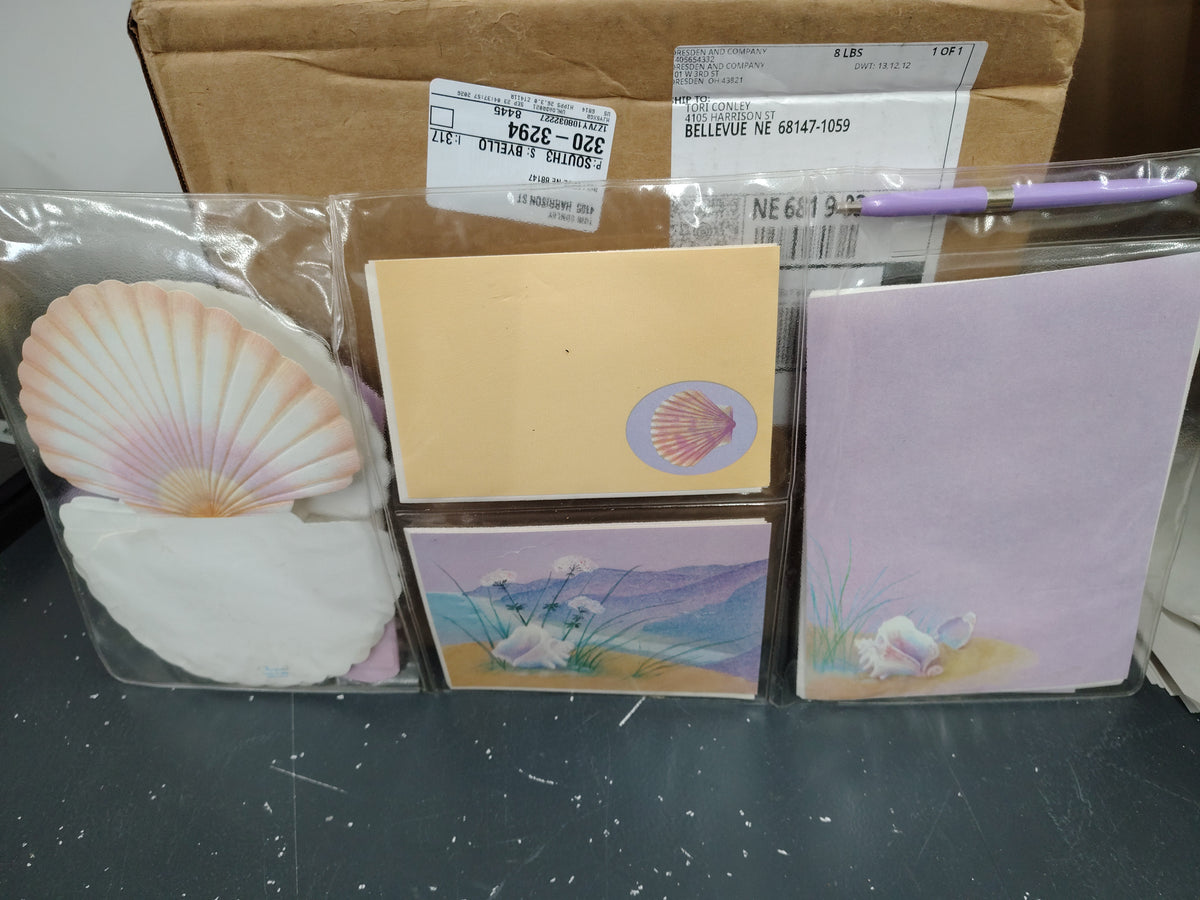 Purple seashell notes and envelopes