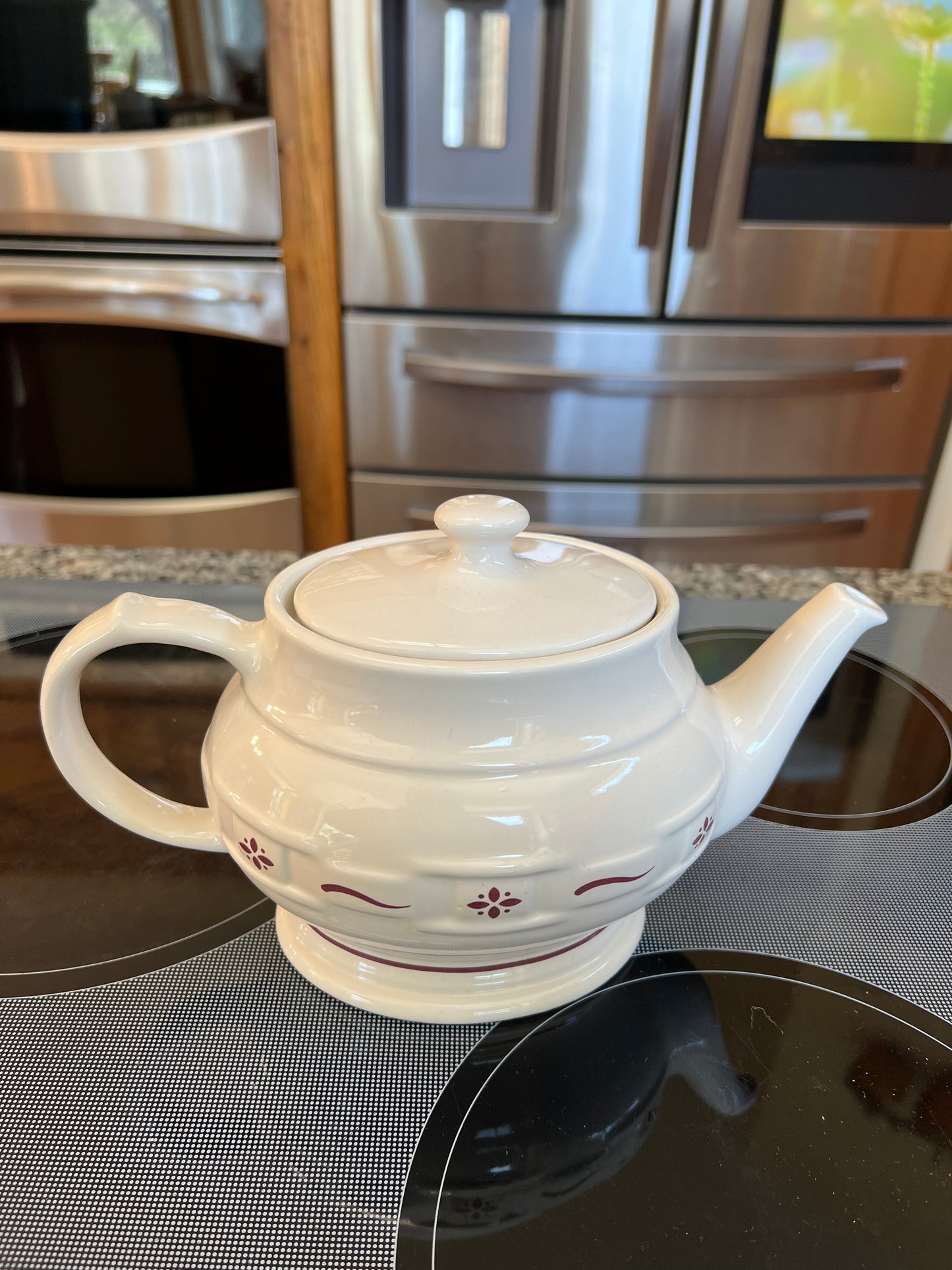 Longaberger teapot in traditional red